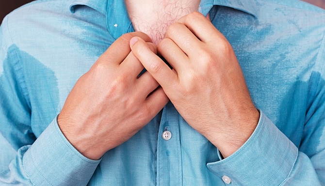 man with a very sweaty shirt