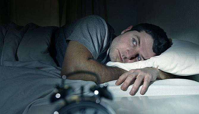 man suffering from night sweats