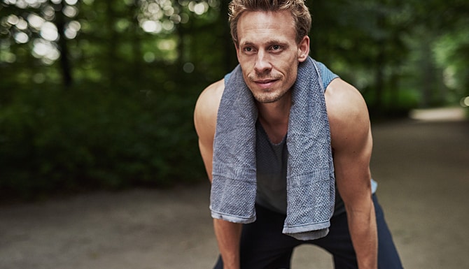 Man with a towel around his neck