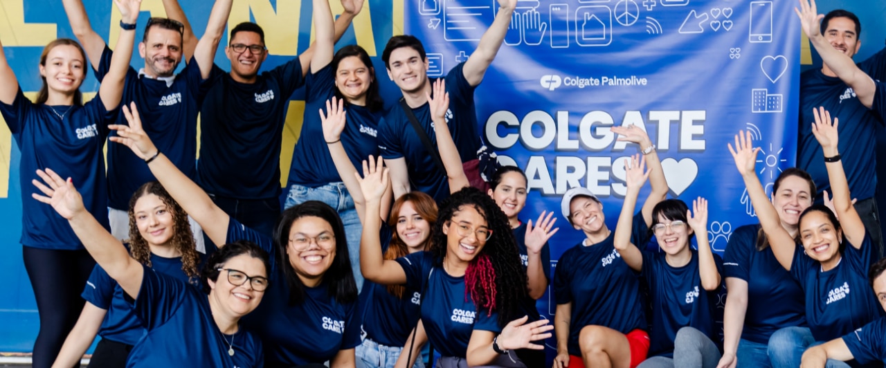 Group of smiling people during a "Global Colgate Cares Days" event.