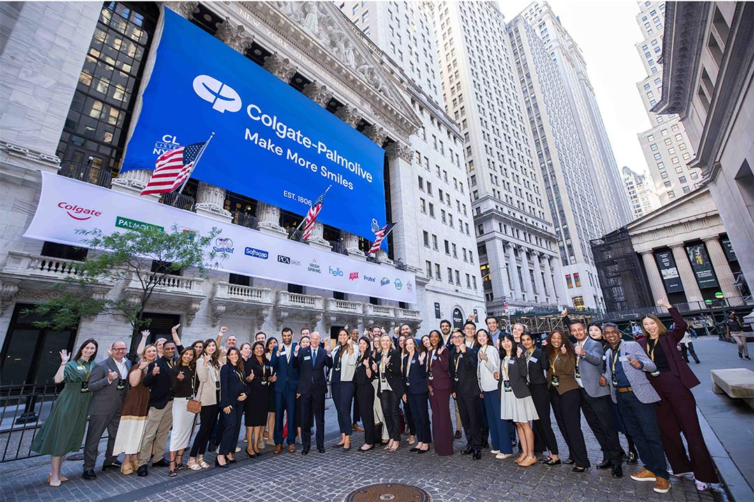 Celebrants on the street in front of the NYSE as a CP banner hangs on the building.