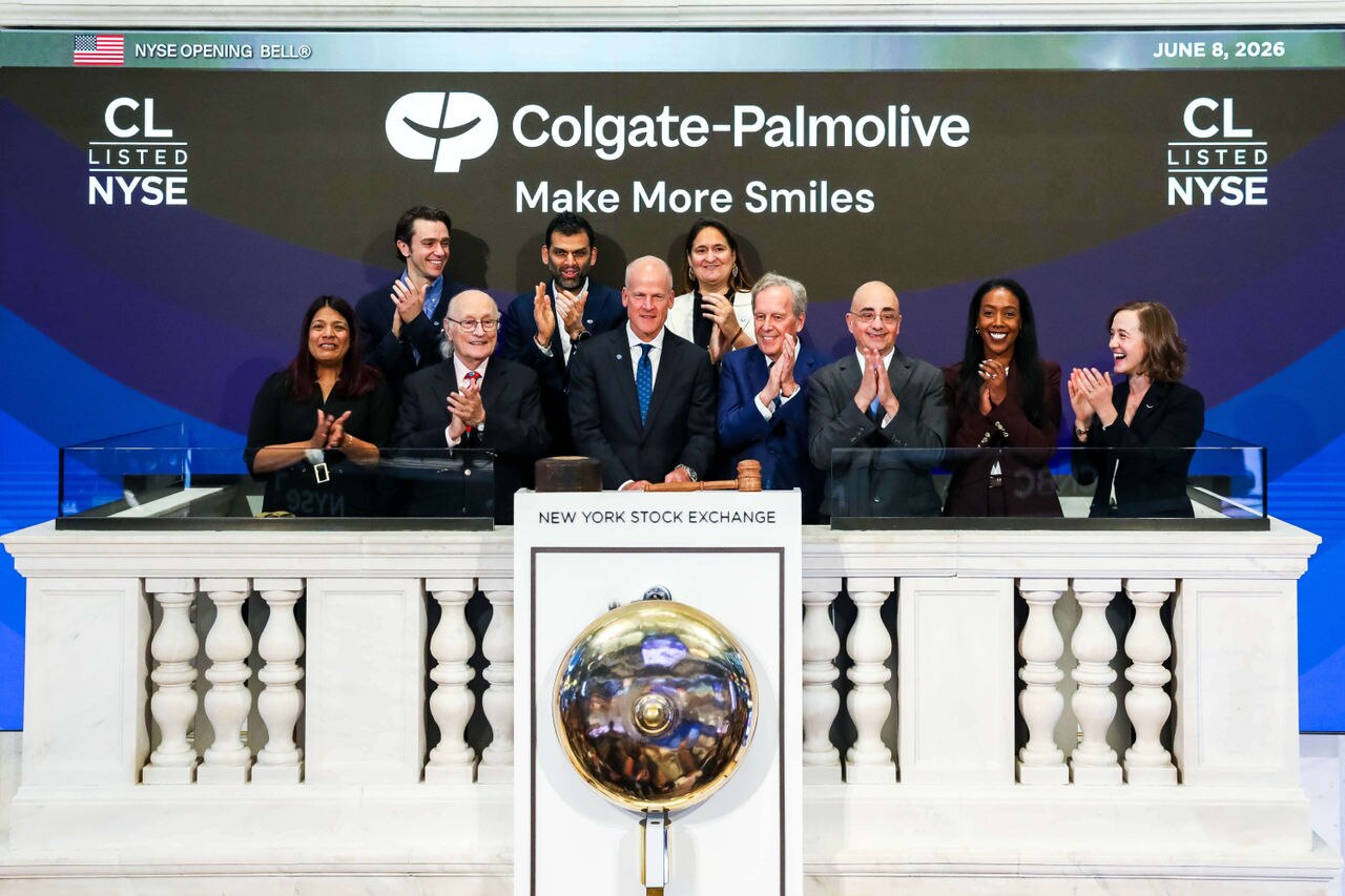 CEO Noel Wallace and executives ring the New York Stock Exchange opening bell for Colgate.