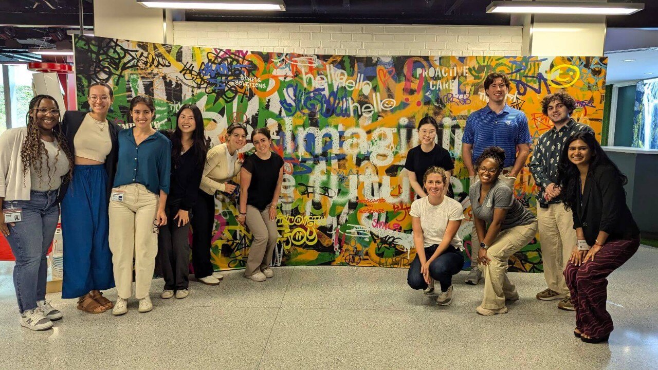 a group of interns smiling