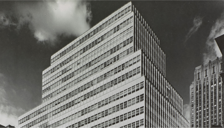 Black and white photo of the Colgate headquarters building from the 1950s