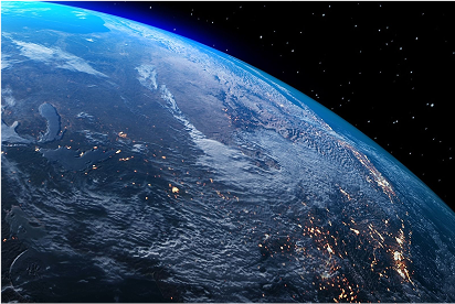 Image of Earth from space showing illuminated continents at night.